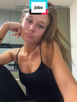 A selfie-style shot featuring a young woman with long, light brown hair. She's wearing a black tank top and is positioned against a blurred backdrop. The top portion of the image contains text overlays, including a blue and white rectangular element with text.
