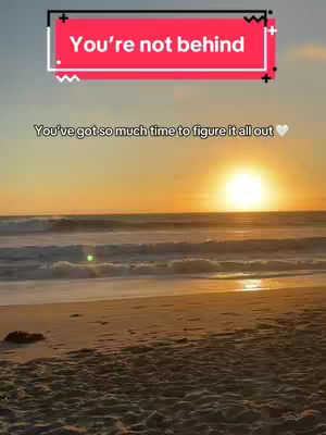 A beautiful shot of a beach at sunset. The sun is a bright orb near the horizon. The sky transitions from orange at the horizon to light blue at the top. The ocean has small waves, and the sand is visible in the foreground. The hook overlays are in the upper part of the image.