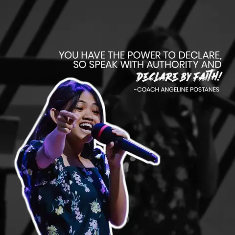 A young woman with long black hair is speaking into a black microphone, pointing her index finger towards the audience. She is wearing a dark floral top with white outlining. The background has a blurred silhouette of a person. A white box with text overlaid.