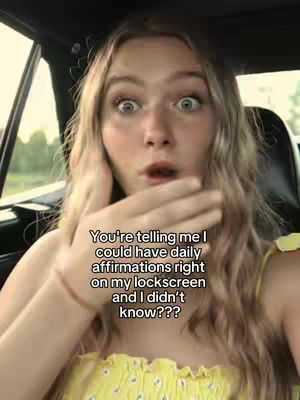 A young woman with long blonde hair is shown up close, with a look of exaggerated surprise. She is in a car, with the window and a portion of the seat visible in the background. Text overlays the image.