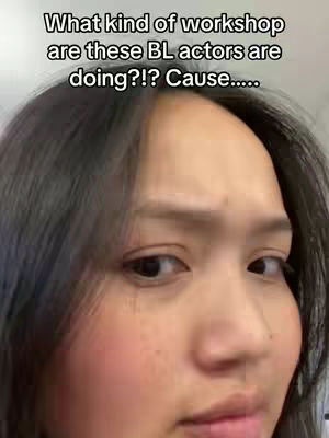A selfie-style shot featuring a person with dark hair looking at the camera with a slightly concerned or curious expression. Text overlay in the upper portion reads 'What kind of workshop are these BL actors are doing?!? Cause.....'. The lighting appears to be natural, and the background is blurred, focusing attention on the person's face.