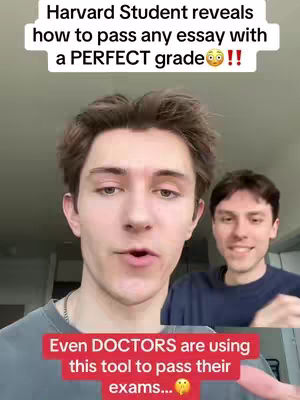 A selfie-style video featuring two young men. The primary focus is on the man at the front who is looking at the camera and speaking. In the background, the second man is also looking towards the camera and is slightly out of focus. The image uses natural lighting. At the top, text overlay reads, 'Harvard Student reveals how to pass any essay with a PERFECT grade !!'. Below the main subject, a red banner overlay states, 'Even DOCTORS are using this tool to pass their exams...', and includes an emoji.