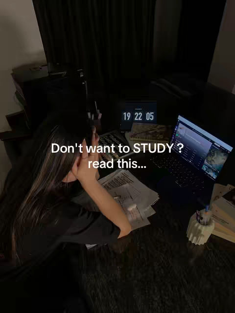 A dimly lit image shows a desk with a laptop displaying a screen and a digital clock showing the time; a person is leaning over the surface. White text overlays the dark background.