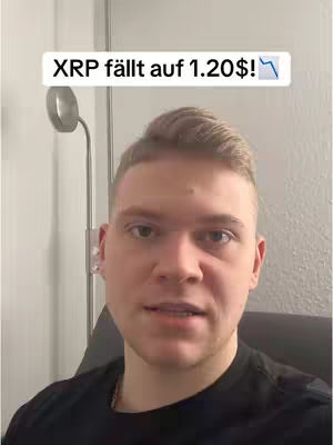 A young man with fair skin and short, light brown hair looks directly at the camera. He wears a black shirt. Above him, a white rectangular label displays text indicating a drop in the cryptocurrency XRP's value, with a downward arrow.