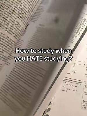 An open book is angled toward the viewer, with the pages displaying printed text. Overlayed on the pages is white text in a bold font.