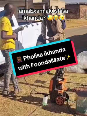 The image shows a scene with several people in an outdoor setting. A text overlay with a black and colorful background is positioned at the bottom center, and it reads 'Pholisa ikhanda with FoondaMate'. One man is on the left side, another is in the middle, and there is a pressure washer present towards the right, along with various other objects.