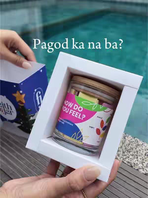 A hand holding a white picture frame containing a glass jar with colorful labels, set against a blurred background of a swimming pool. The main text overlay reads 'Pagod ka na ba?'