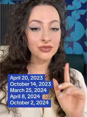 A woman with dark curly hair and makeup is positioned in a front-facing close-up. She is pointing upwards with her index finger. Behind her is a patterned wall, and a blue rectangle with white text.