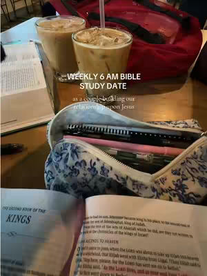 The image shows a table with two glasses of iced coffee, an open book with text, a pen case, and a red bag in the background. The text overlay says 'WEEKLY 6 AM BIBLE STUDY DATE as a couple building our relationship upon Jesus.'