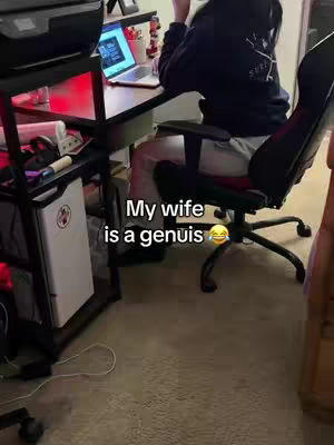 The cover image shows a person sitting at a desk with a laptop. Text overlayed at the bottom states 'My wife is a genius' with a laughing emoji.