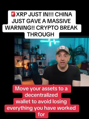A man in a black t-shirt and a baseball cap is speaking in from of a background with a shelf filled with books and other items. The image has red text that says "Move your assets to a decentralized wallet to avoid losing everything you have worked for". The white text says "XRP JUST IN!!! CHINA JUST GAVE A MASSIVE WARNING!! CRYPTO BREAK THROUGH".