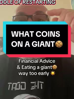 The cover shows a man with glasses in front of a background with text in a colored box and additional text on the black tee-shirt.