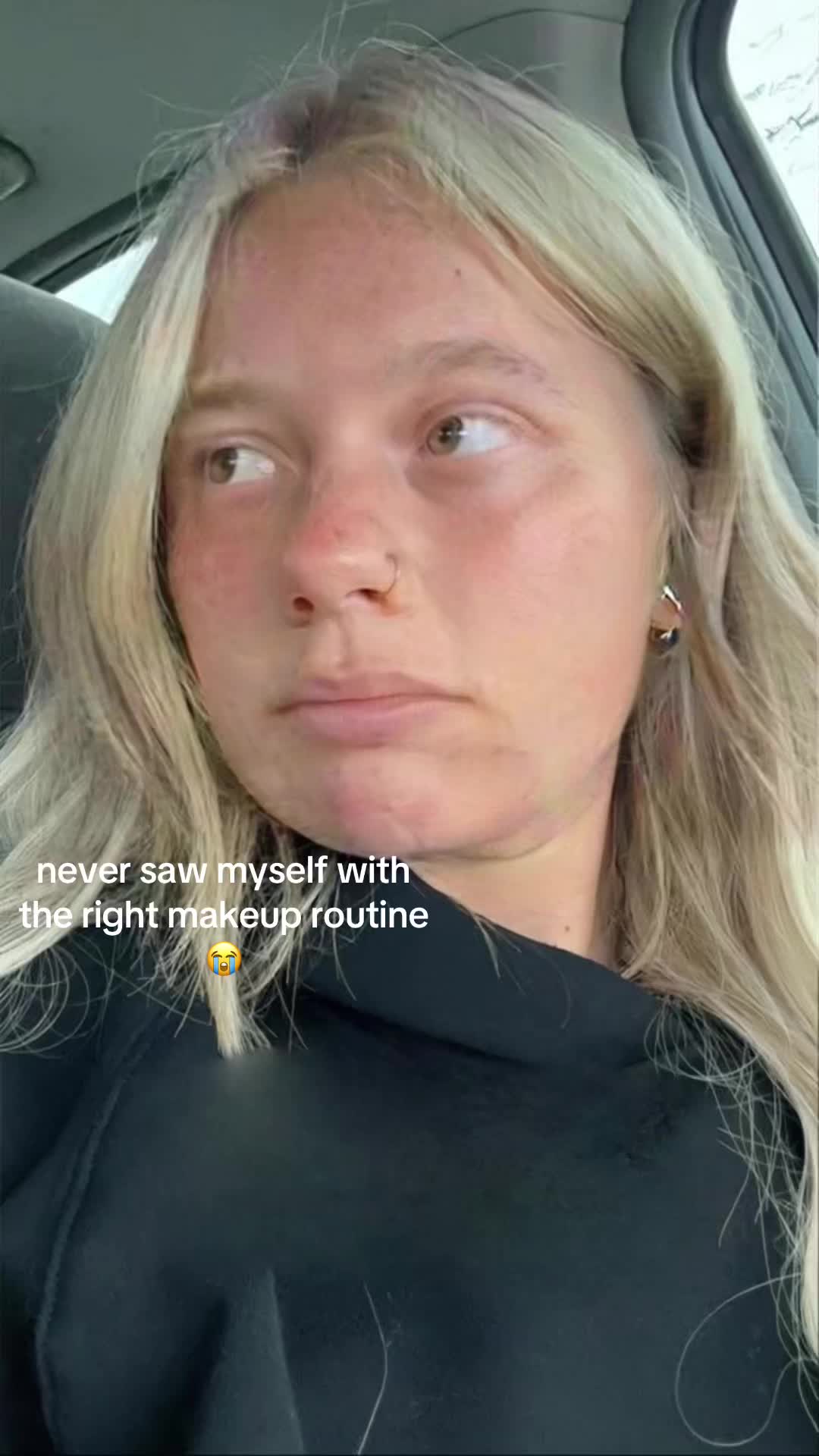 The cover image shows a close-up of a woman inside a car. The woman has blonde hair and is looking to the side with a neutral expression. The background shows a car interior.