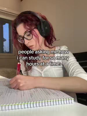 A young woman with red-tinted hair and glasses is seated at a table, appearing to be studying. She has headphones on and looks down at a notebook and pen. Text overlays the image, posing a question.