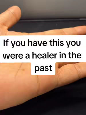 The cover image shows a close-up of a person's open palm, with text overlaid on the image. The hand is held against a blurred, dark background.