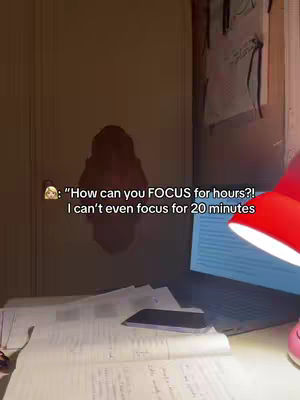 The cover image shows a study desk with papers, a laptop, and a red desk lamp. The setting is dimly lit, and text overlays are present on the left side.