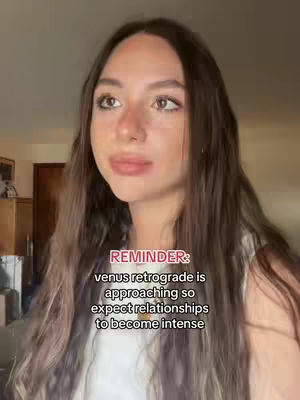 A woman with long brown hair looking slightly to the left, with text overlayed on the image. The background is a blurred interior.