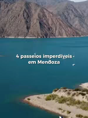 The image shows a panoramic view of a lake or reservoir with mountains in the background. The water is a clear, turquoise color, and a strip of land with some vegetation is visible along the bottom. The sky is partially visible and appears overcast. Text overlayed on the image reads '4 passeios imperdíveis em Mendoza' in white, sans-serif font.