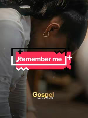 The cover image showcases a close-up of a person's face, angled from the side. The person's dark hair is partially visible, with a close-up view of their ear, adorned with a small hoop earring. A text box overlay is prominent, featuring the text 'Remember me' in a bold, white font against a red background. The text box is framed by black borders and white zig-zag and plus signs. Below this, the logo 'Gospel Lyrics_World' in gold, is positioned. It appears to be a still from a video.