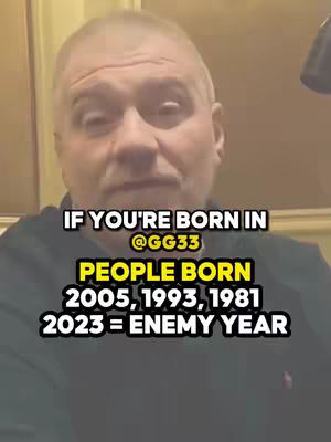 A man with short gray hair and a black sweater is centered in the frame, facing the camera. Text overlays in a combination of white and yellow highlight the video's theme. The background is a plain, light-colored wall.