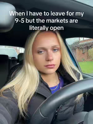 The cover image features a blonde woman sitting in the driver's seat of a car. She has a neutral expression and her hair is styled down. Text overlayed on the image reads, "When I have to leave for my 9-5 but the markets are literally open."