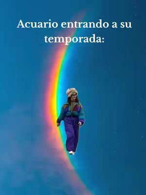 A woman with a hat and glasses is walking on a rainbow that is arched across a blue sky. The text overlay says, "Acuario entrando a su temporada:"