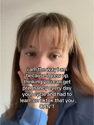 A close-up shot of a young woman's face, with her hair parted in the middle and framing her face, creating gentle waves. She is wearing a dark top. Her hand partially covers her mouth, while text is overlaid on the image, written in a white, sans-serif font.