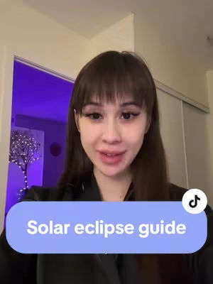 A woman with long brown hair and bangs is in front of a door. There is a light blue bar with the text "Solar eclipse guide".