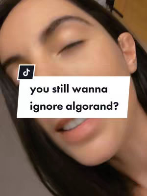 A close-up shot features a woman’s face, angled slightly from above. Her eyes are nearly closed, and her lips are slightly parted. A white rectangle with black text overlays the image, and a small TikTok logo is visible in the upper left corner.