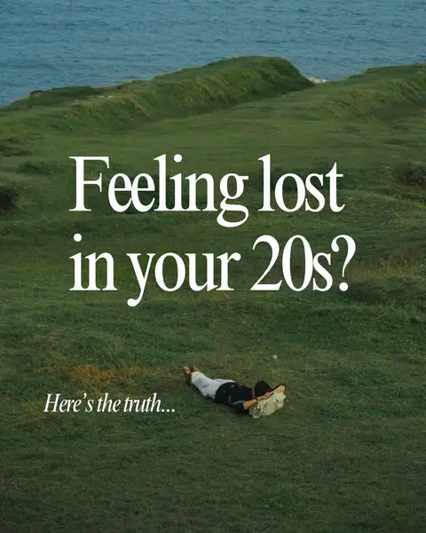 An individual lies on the grass in a field with a serene landscape in the background. The sky is partially visible, and text overlayed on the image asks "Feeling lost in your 20s?" with the text "Here's the truth..." below.