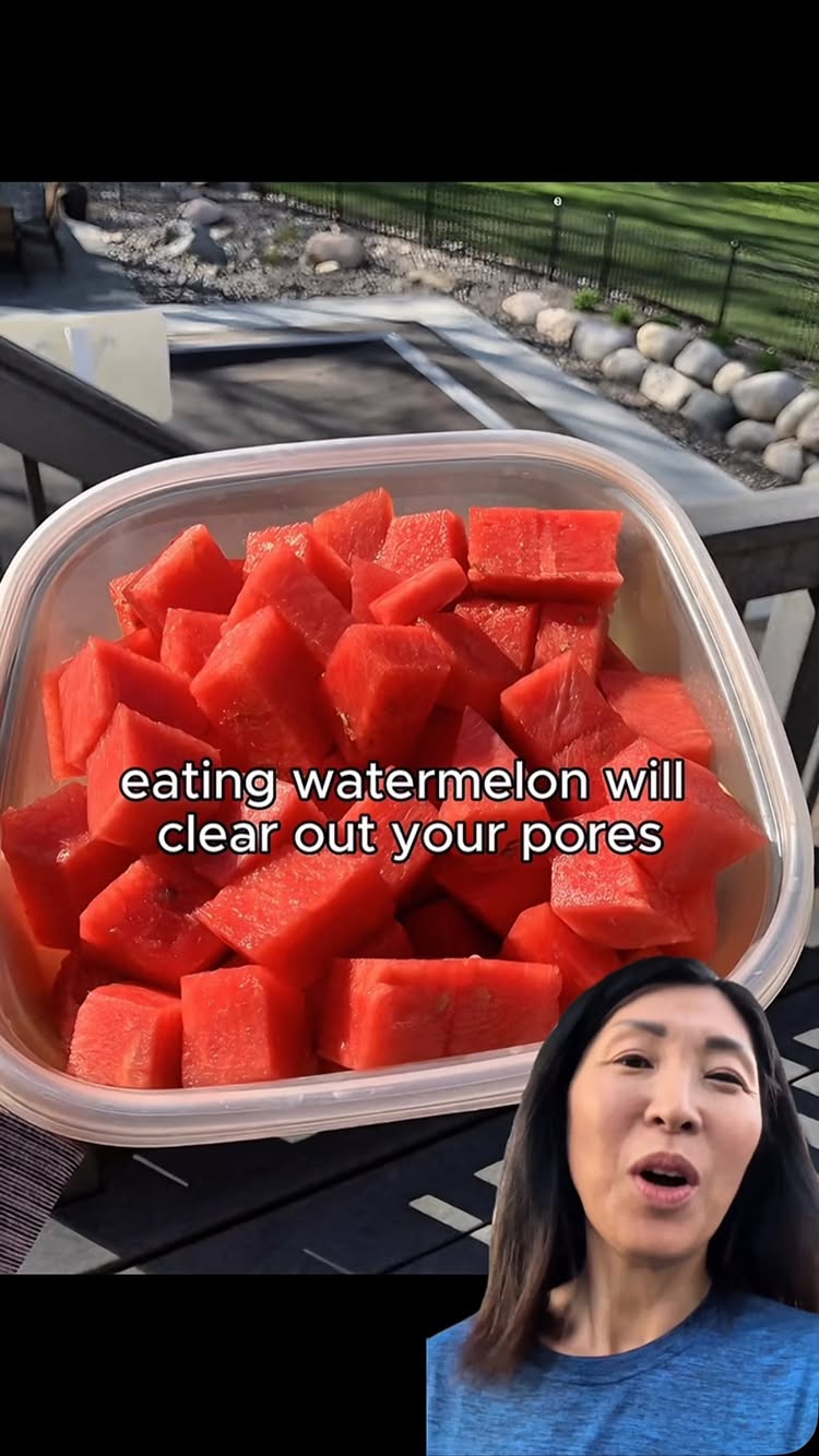 The cover image shows a clear plastic container filled with diced watermelon, with the text overlayed on it. A woman with dark hair and wearing a blue shirt is in the lower right corner, her mouth open as if speaking. The background is blurred but appears to be outdoors, with a glimpse of a deck and greenery.