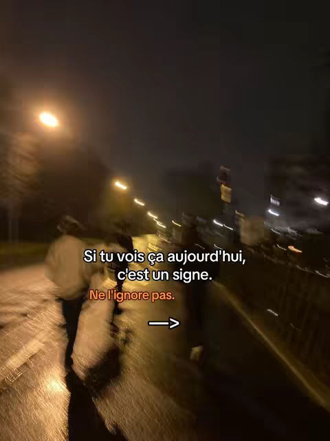 The cover image is a nighttime shot, likely taken on a wet road, with blurred movement suggesting walking. The scene is illuminated by streetlights, casting a warm glow. In the midground, two figures are silhouetted, walking towards the left. Text overlays in a clean white font appear in the center-top, along with an arrow pointing right, guiding the viewer's attention.