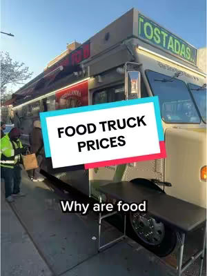 The cover image shows the side of a food truck parked on a city street. The food truck is beige with red and white signage, possibly advertising 'Tostadas'. In the foreground, there is a black table extending from the side of the truck. A person in a high-visibility vest stands near the truck, possibly interacting with the food truck staff. The sky is clear and blue.