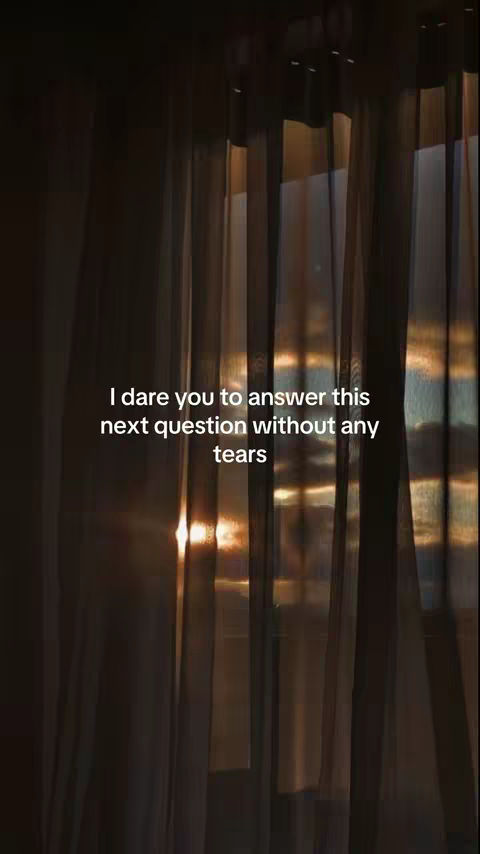 The image shows a dimly lit scene with vertical streaks, possibly curtains, and a soft glow of light filtering through from behind. Text is overlaid towards the middle-left side, and the overall composition evokes a contemplative, intimate atmosphere.