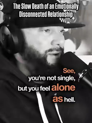 A black and white image features a man in a black hoodie and a cap, wearing headphones and speaking into a microphone. Text overlays appear at the top and the bottom of the image.