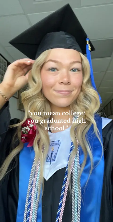 A young woman in a graduation gown and cap smiles at the camera. She has blonde curly hair and is wearing a black graduation cap with a blue tassel and a blue and white graduation stole. Text overlays the image.