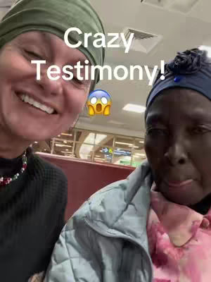 The cover shows a selfie-style view featuring two women. The woman on the left has light skin, with a green head covering. She's smiling with teeth visible. The other woman has dark skin and wears a blue head covering. Both are indoors with a background and text overlay.