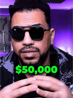 A man facing the camera, wearing sunglasses and a black jacket with a patterned design. A text overlay in large green font reads '$50,000'. The background is a blurred, indistinct purple.