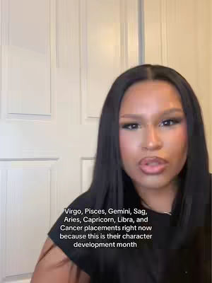 A selfie-style video shows a woman in front of a white door, speaking to the camera. The text overlay describes zodiac placements pertinent to character development.