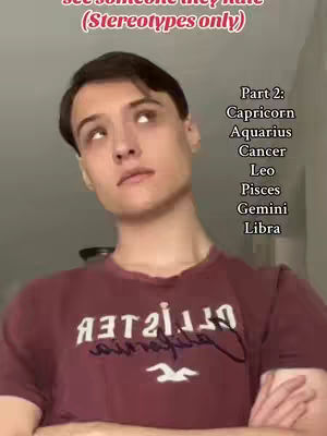 A person with fair skin is the central focus, gazing upwards with a slightly bemused expression. The person, who has short, dark hair, is wearing a maroon t-shirt with white lettering. The image has a neutral background, with the focus sharply on the individual and the text overlay.