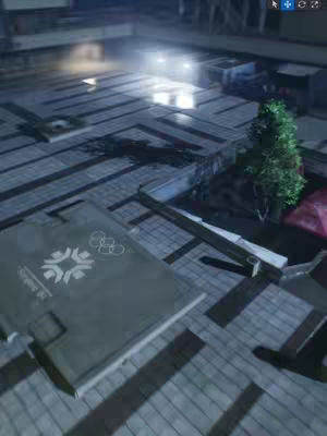 An overhead view of a digital rendering of an outdoor space, likely a city plaza. The ground is paved with light-colored tiles, and the scene is lit with what seems to be artificial lighting, casting long shadows. There's a suggestion of buildings or structures in the background, and a realistic depiction of a tree is situated on the right side of the image.