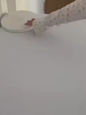 The cover image shows a person's arm and hand touching what appears to be a thermal printer. The printer is white, and the surface beneath it is also white. The person is wearing a long-sleeved shirt with a textured or patterned design. The overall composition is simple, with a neutral color palette.