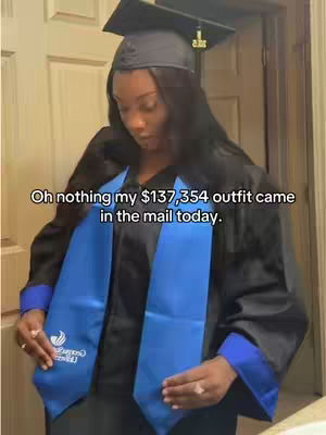 A woman in a graduation gown, holding a blue sash with the Georgia State University logo. Text overlay mentions an expensive outfit.