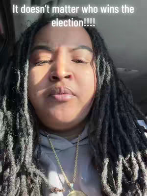 Close-up shot of a person with long, dark dreadlocks and a gold chain necklace, framed against a neutral background. The person's face is centered, with a neutral expression. Text overlay at the top states, 'It doesn't matter who wins the election!!!!'