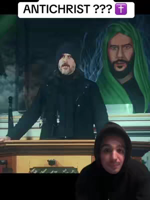The cover image presents a split-screen effect with a casual, selfie-style video overlayed on the bottom. The upper portion features a man in a setting that appears to be a religious establishment. Behind him is a large painting of a man wearing a green garment. Text overlayed at the top reads 'ANTICHIST ???' with a cross symbol. The lower section shows the creator, a man wearing a hoodie, looking at the camera.