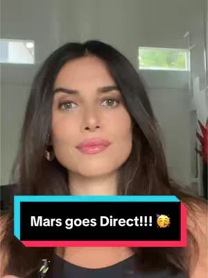 A woman with long brown hair and a black top is centered in the frame. A text overlay at the bottom features the phrase Mars goes Direct!!!