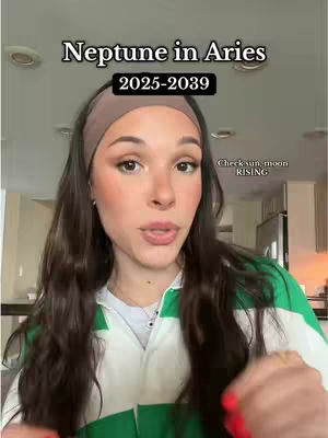 A woman with long dark brown hair wearing a green and white striped shirt and a brown headband is looking at the camera and talking. Text overlays at the top read "Neptune in Aries" and "2025-2039."