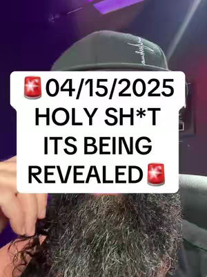 A man with a beard and a black cap holds a white sign in front of his face. The sign has the date "04/15/2025" at the top, followed by the phrases "HOLY SH*T" and "ITS BEING REVEALED". Red siren emojis flank the text. The background has a purple and dark ambiance.