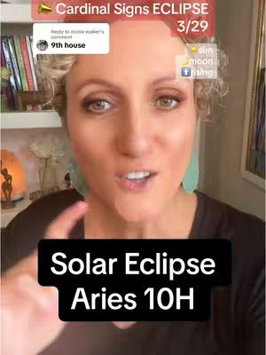 A woman with fair skin and curly blonde hair is the central focus, with a warm, inviting expression. She's positioned in front of a blurred background with a bookshelf to the left and what appears to be a lamp behind her. The image is well-lit, with a slight warm tone, enhancing the overall friendly and engaging feel.