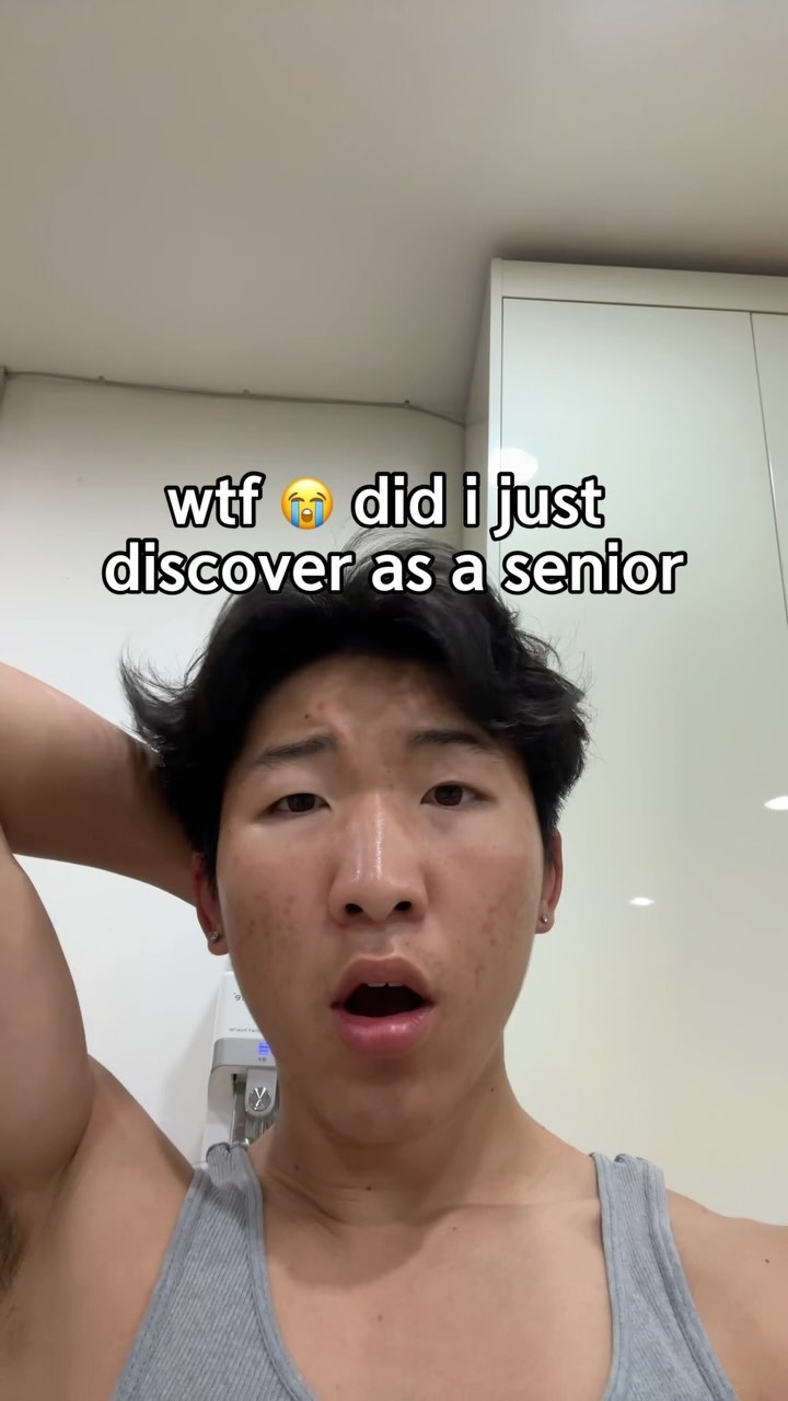 The cover image features a close-up selfie of a young man with dark hair, looking directly at the camera with an open mouth, his expression one of surprise or shock. The hook text is overlaid at the top. The background appears to be a plain white wall or cabinet.